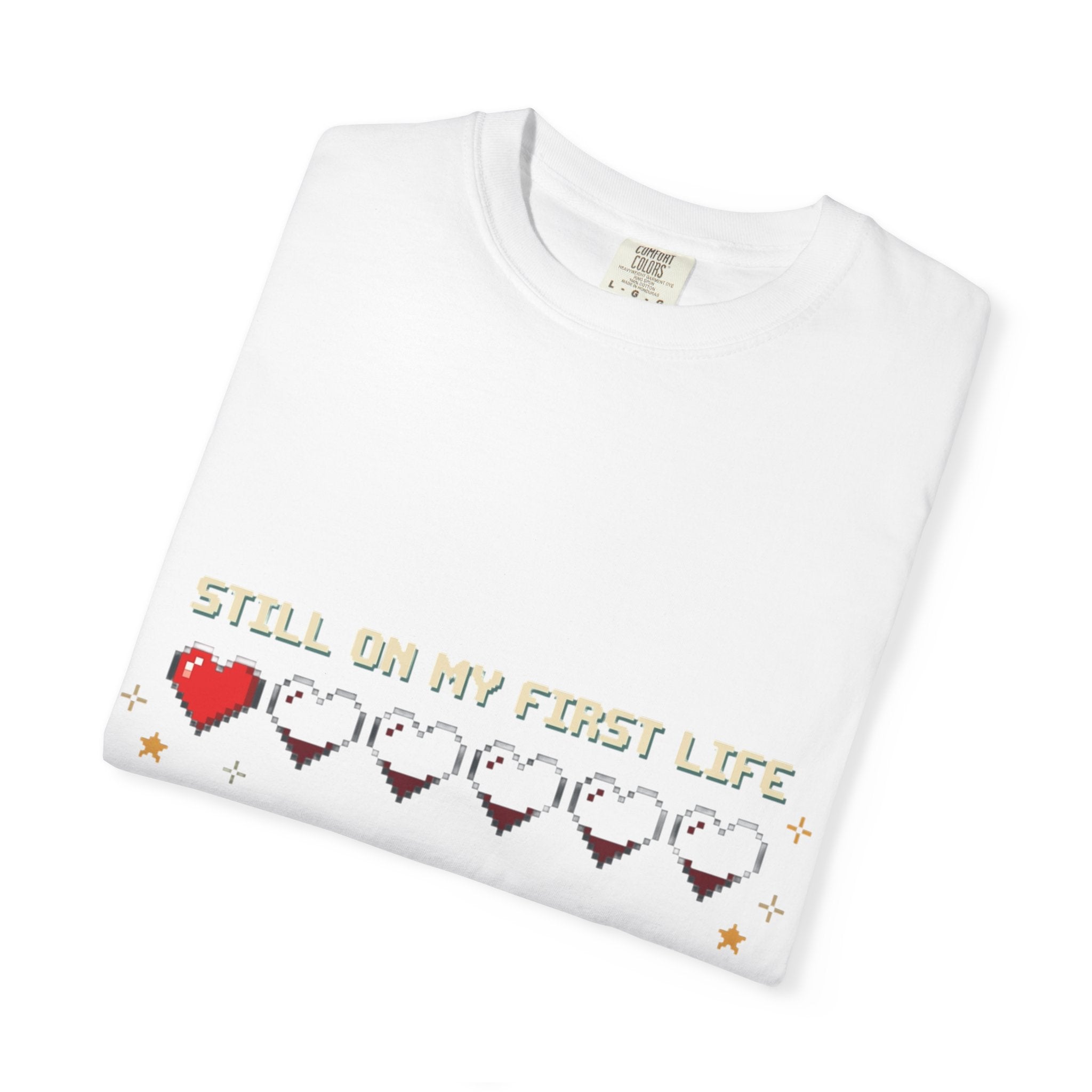 T-Shirt — "Still on My First Life" Pixel Heart Gaming Tee